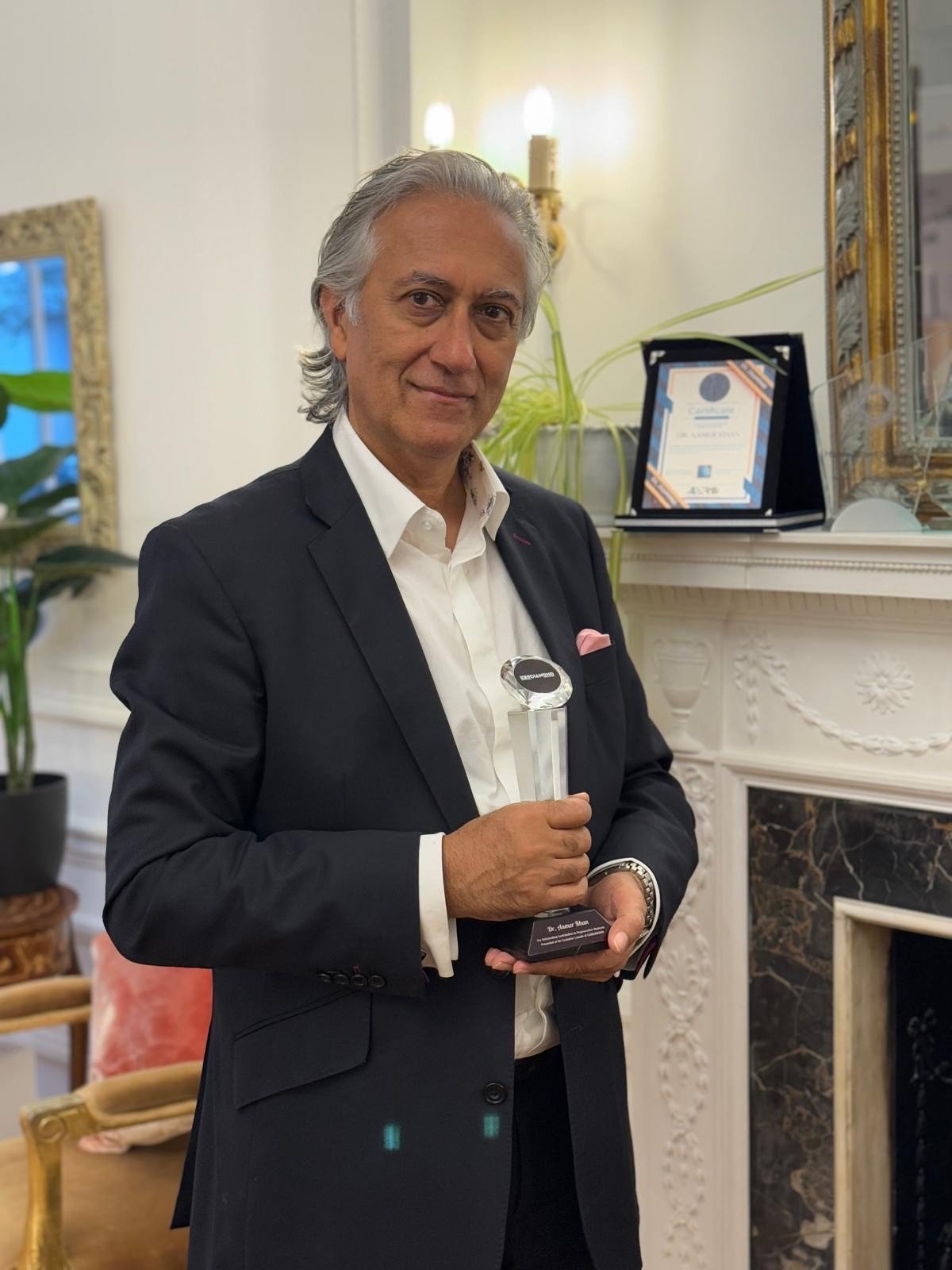Professional man in dark blazer and white shirt in an elegant interior setting, reflecting the discreet consultation environment of Harley Street
